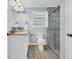 Well-lit bathroom featuring a glass-door shower, modern vanity, and updated fixtures at 1445 Woodhill Dr, Marietta, GA 30066