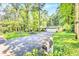 Spacious home with a long driveway and beautiful surrounding greenery, providing a sense of privacy at 1445 Woodhill Dr, Marietta, GA 30066