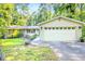 Charming home with a two-car garage and well-maintained landscaping, nestled among mature trees at 1445 Woodhill Dr, Marietta, GA 30066