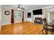 Hardwood floors and a charming fireplace highlight this inviting living space adjacent to kitchen and dining areas at 1445 Woodhill Dr, Marietta, GA 30066