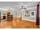 Open-concept living room featuring hardwood floors, kitchen island, and natural light at 1445 Woodhill Dr, Marietta, GA 30066