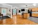 Bright living area seamlessly connected to kitchen, featuring hardwood floors, fireplace and island seating at 1445 Woodhill Dr, Marietta, GA 30066