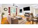 Cozy living room with a fireplace, comfortable seating, and large windows offering natural light at 1445 Woodhill Dr, Marietta, GA 30066