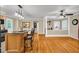 Open-concept living room featuring hardwood floors, kitchen island, and natural light at 1445 Woodhill Dr, Marietta, GA 30066