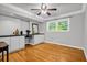 Office space featuring wood flooring, built-in cabinets and desk, and bright natural light at 1445 Woodhill Dr, Marietta, GA 30066