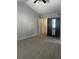 Carpeted bedroom featuring a ceiling fan and an armoire with mirrored door at 1910 Glynmoore Dr, Lawrenceville, GA 30043