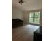 Cozy bedroom with a large window offering a scenic outdoor view at 1910 Glynmoore Dr, Lawrenceville, GA 30043