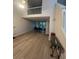 Bright living room with fireplace, wood floors, and view into dining area at 1910 Glynmoore Dr, Lawrenceville, GA 30043