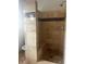 Walk-in shower featuring custom tile work, a built-in seat, and modern fixtures at 1910 Glynmoore Dr, Lawrenceville, GA 30043