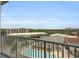 Apartment balcony overlooking a pool and cityscape on a clear, sunny day at 361 17Th St # 910, Atlanta, GA 30363