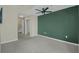 Spacious bedroom with a walk-in closet, ensuite bath, plush carpeting, and an accent wall at 361 17Th St # 910, Atlanta, GA 30363