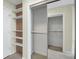 Spacious closet with sliding doors and built-in shelving for optimal storage at 361 17Th St # 910, Atlanta, GA 30363