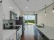 A modern kitchen with stainless steel appliances, white cabinets, and great views from the connected living space at 361 17Th St # 910, Atlanta, GA 30363
