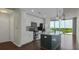 Modern kitchen with white cabinets, stainless steel appliances, and an island overlooking a beautiful view at 361 17Th St # 910, Atlanta, GA 30363