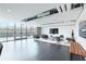 Bright resident lounge with floor to ceiling glass, and modern furnishings at 361 17Th St # 910, Atlanta, GA 30363