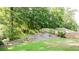 Backyard view with trees and grass at 4628 Mcever View Dr, Sugar Hill, GA 30518