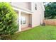 The backyard has a covered patio and green grass at 4628 Mcever View Dr, Sugar Hill, GA 30518