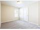 A bright bedroom features neutral walls, carpet, and a window for natural light at 4628 Mcever View Dr, Sugar Hill, GA 30518