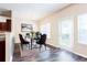 Bright dining room featuring hardwood flooring, modern table and outdoor access at 4628 Mcever View Dr, Sugar Hill, GA 30518