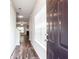Inviting entryway featuring hardwood floors and a view into the living room with fireplace at 4628 Mcever View Dr, Sugar Hill, GA 30518
