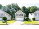 Charming two-story home featuring neutral siding, a well-manicured lawn and a two car garage at 4628 Mcever View Dr, Sugar Hill, GA 30518