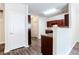 Open kitchen featuring dark wood cabinets, hardwood flooring and eat-in space at 4628 Mcever View Dr, Sugar Hill, GA 30518
