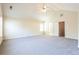 Large main bedroom with vaulted ceiling, neutral walls and carpet, and attached ensuite bathroom at 4628 Mcever View Dr, Sugar Hill, GA 30518