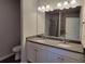 Bathroom featuring double sinks and a spacious granite countertop at 210 Park Place Trl, Social Circle, GA 30025