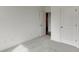 Bedroom featuring plush carpeting and an open doorway with a closet at 130 W Main Street # 1, Buford, GA 30518
