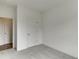 Spare bedroom with plush carpeting, closet and an open doorway at 130 W Main Street # 1, Buford, GA 30518