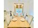 Elegant dining room with a wooden table, stylish chandelier, and a serene ambiance at 130 W Main Street # 1, Buford, GA 30518
