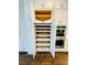 Organized pantry with pull-out shelving, providing ample storage space in the kitchen at 130 W Main Street # 1, Buford, GA 30518