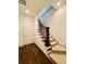 Elegant staircase with wooden railing and carpeted steps leading to upper floor at 130 W Main Street # 1, Buford, GA 30518