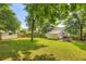 Expansive backyard with mature trees and shed at 512 Allendale Dr, Decatur, GA 30032