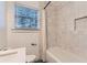 Bright bathroom with white subway tile, shower, and modern vanity at 512 Allendale Dr, Decatur, GA 30032