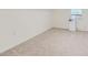 Bright carpeted bedroom with white walls and window at 512 Allendale Dr, Decatur, GA 30032