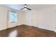 Spacious bedroom with hardwood floors and a large window providing natural light at 512 Allendale Dr, Decatur, GA 30032