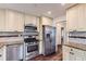 Bright kitchen features stainless steel appliances, granite countertops, and subway tile backsplash at 512 Allendale Dr, Decatur, GA 30032