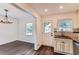 Eat-in kitchen featuring granite countertops, subway tile backsplash, and access to backyard at 512 Allendale Dr, Decatur, GA 30032