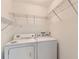 Laundry room featuring a washing machine, dryer, and storage shelves at 512 Allendale Dr, Decatur, GA 30032