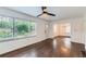 Inviting living room featuring gleaming hardwood floors, a ceiling fan, and abundant natural light at 512 Allendale Dr, Decatur, GA 30032