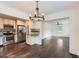 Open-concept living space featuring a dining area and a modern kitchen with stainless steel appliances and hardwood floors at 512 Allendale Dr, Decatur, GA 30032