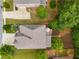 An aerial view of the home shows the roof, surrounding lawn and mature trees at 5473 Heatherbrooke Nw Dr, Acworth, GA 30101