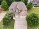 An aerial view of a two-story home highlights the roof, driveway, and surrounding landscaping at 5473 Heatherbrooke Nw Dr, Acworth, GA 30101