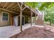 Exterior of a home with a deck and backyard with pine straw at 5473 Heatherbrooke Nw Dr, Acworth, GA 30101