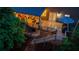 Backyard view featuring a multi-level deck with an outdoor seating area and grilling space at 5473 Heatherbrooke Nw Dr, Acworth, GA 30101