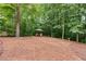 Backyard featuring a seating area and mature trees at 5473 Heatherbrooke Nw Dr, Acworth, GA 30101