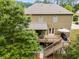 Backyard view featuring a multi-level deck with an outdoor seating area and grilling space at 5473 Heatherbrooke Nw Dr, Acworth, GA 30101