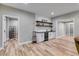 Basement with a bar, mini fridge, wood floors and recessed lighting at 5473 Heatherbrooke Nw Dr, Acworth, GA 30101