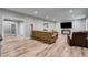 Living area featuring wood floors and a large television at 5473 Heatherbrooke Nw Dr, Acworth, GA 30101